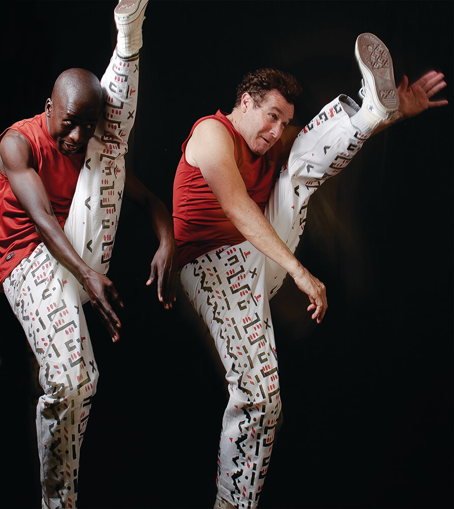 A performance reflecting the style danced in Johannesburg’s hostels by migrant workers from KwaZulu Natal. © Patrick de Mervelec